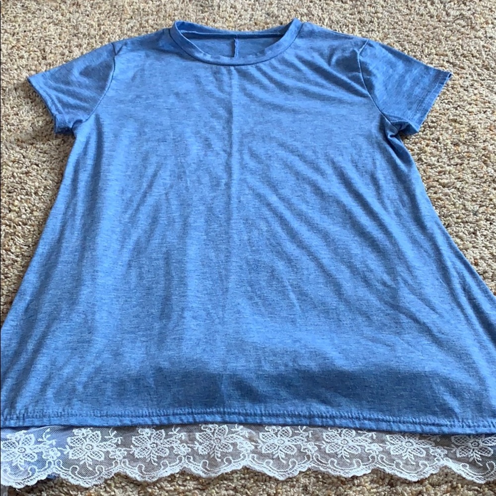 blue flowy shirt w lace trim on bottom